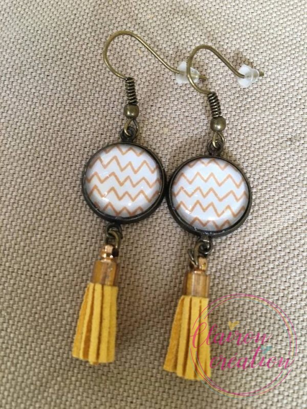 Boucles pompon motif zig zag jaune orangé