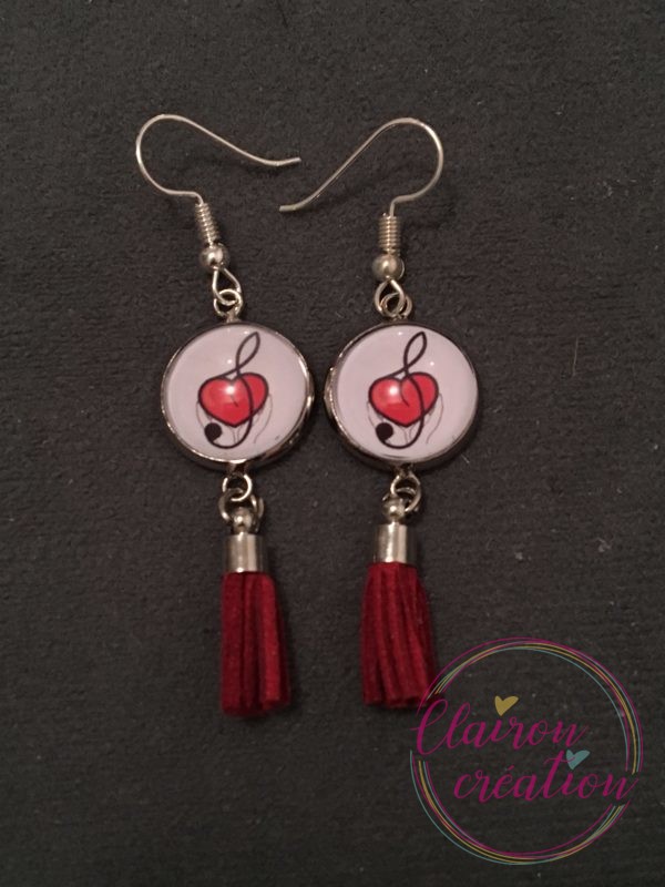 Boucles pompon Logo APDC