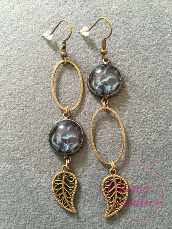Boucles pendantes feuilles fond noir