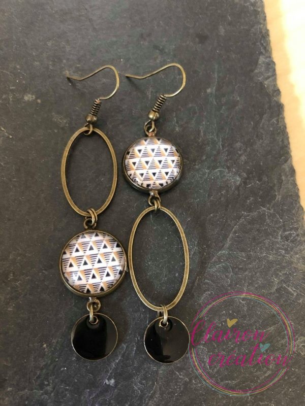 Boucles pendantes motif géometrique noir doré
