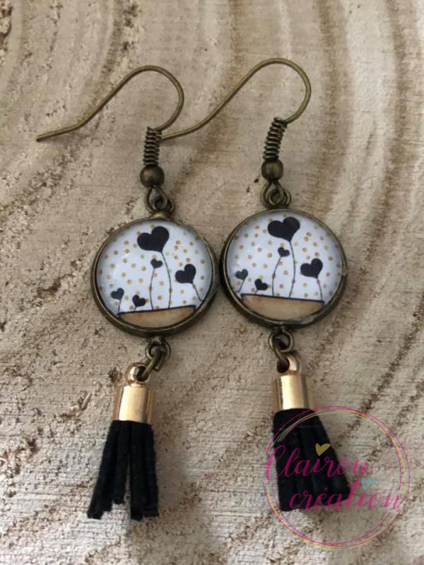 Boucles pompon noir cœur de cerf volant