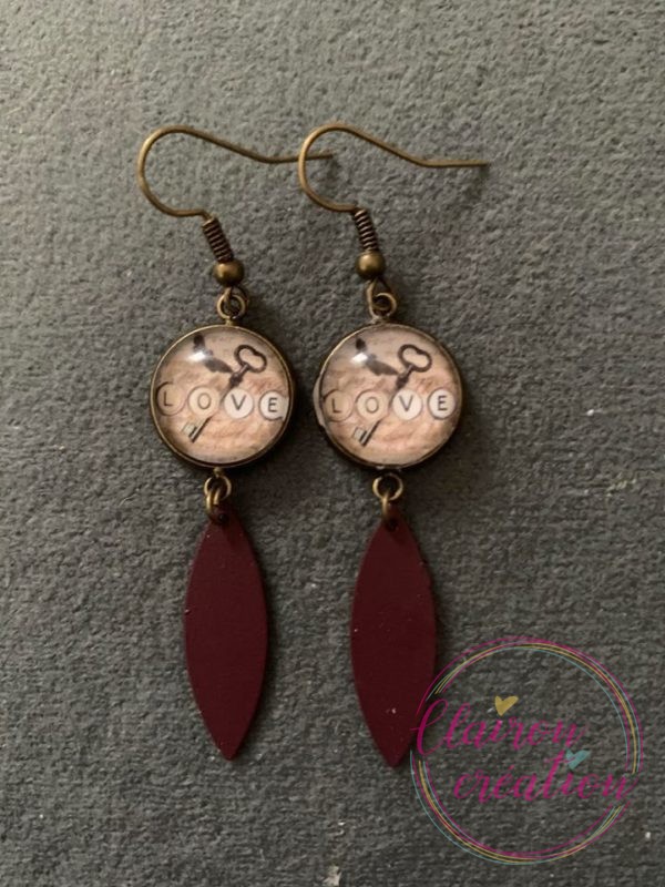 Boucles pendantes la clef du Bonheur